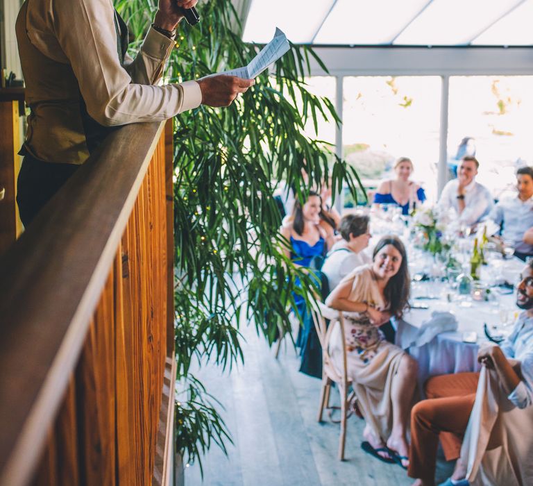 Groom gives speech during reception on his wedding day | Story + Colour