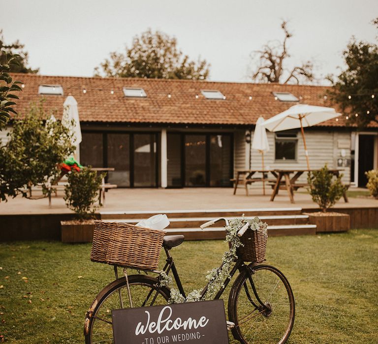 Rustic bike decor with chalkboard wedding sign at East Afton Farmhouse