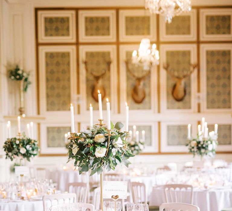 Elegant wedding reception at Drumtochty Castle with candelabra table centrepiece decor 