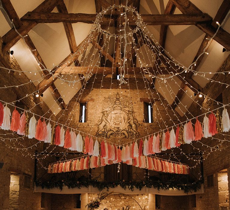 Beautiful DIY tassel bunting and crazy in love wedding sign with fairy light backdrop