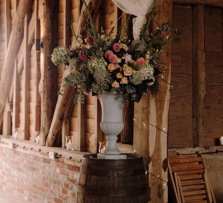 Blush and cream wedding flowers in decorative vase for wedding