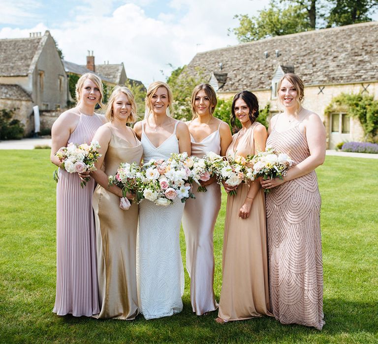 Different shades of pink bridesmaid dresses for summer wedding at Caswell House wedding venue 