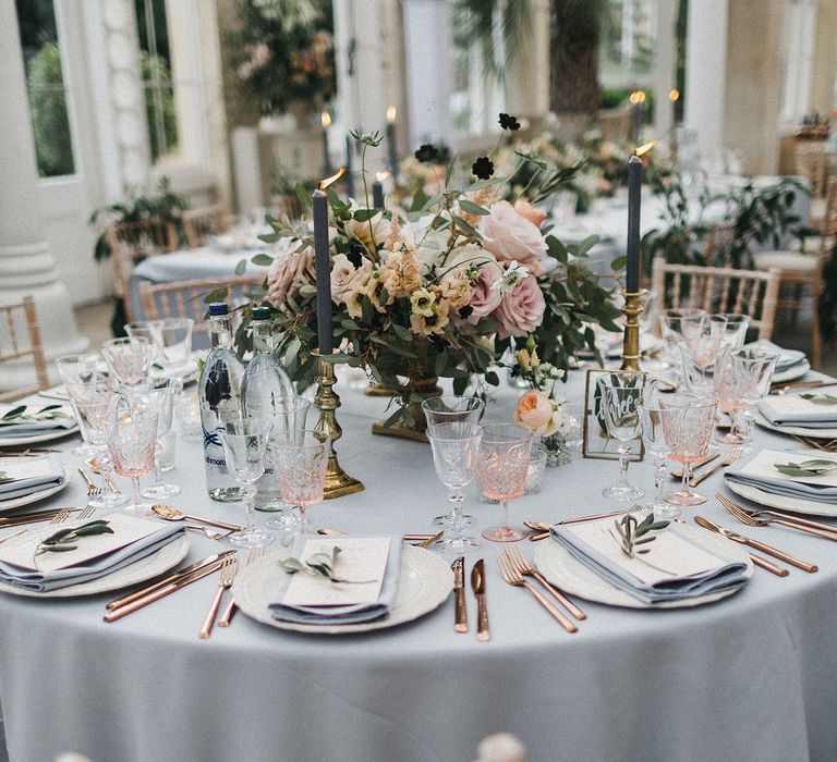 Pastel wedding reception table decor in Syon Park's conservatory 