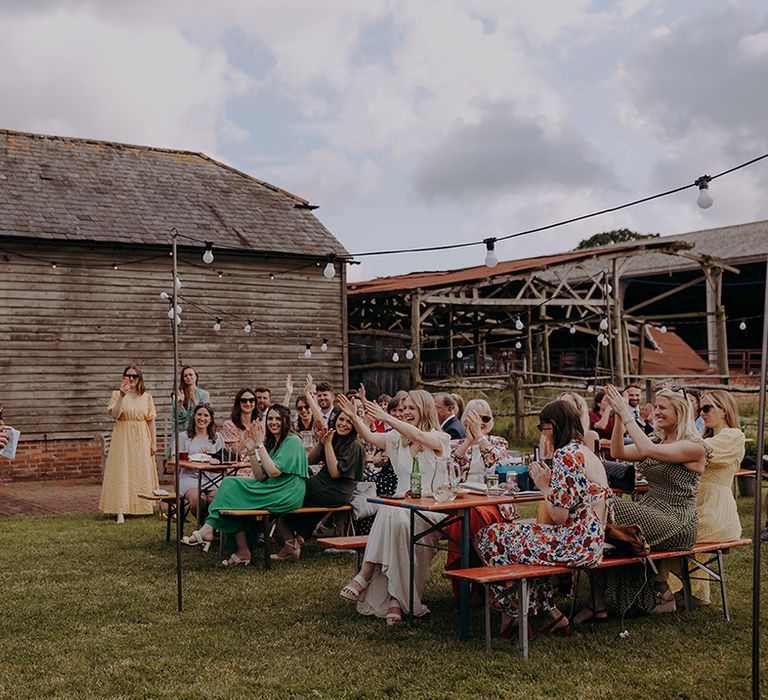 Groom gives a speech at his rustic wedding 