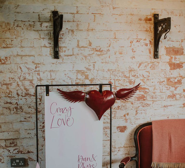 Crazy In Love wedding sign on a metal frame with red heart and giant star decor 