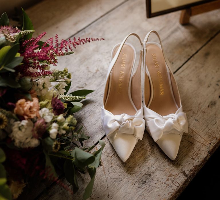 White pointed slingback wedding shoes with bow from Stuart Weitzman 