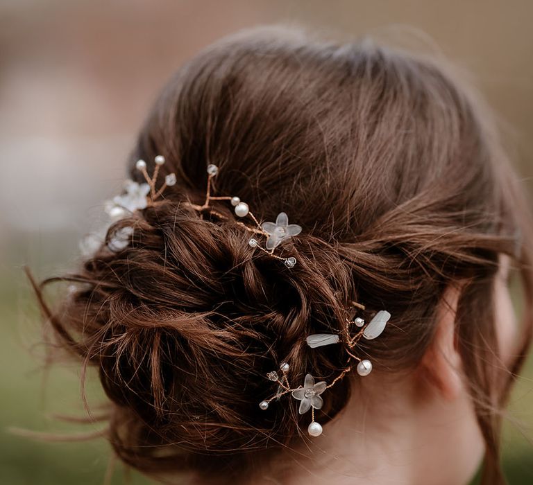 loosely pinned bun with hair vine wedding accessory 