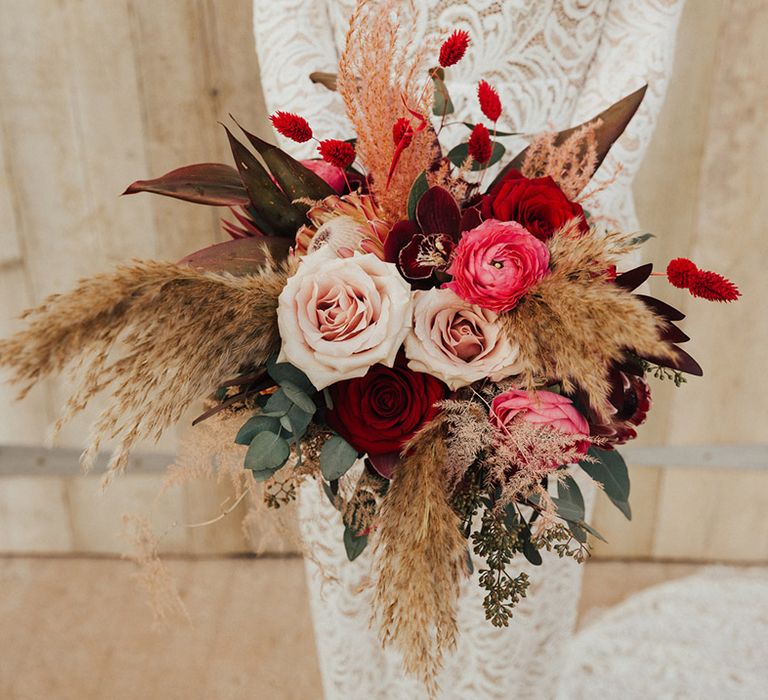 Pink and red roses with bunny grass and pampas grass for bridal bouquet 