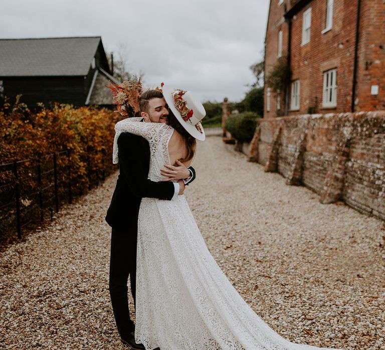 The bride and groom have a first look moment for their boho wedding day 