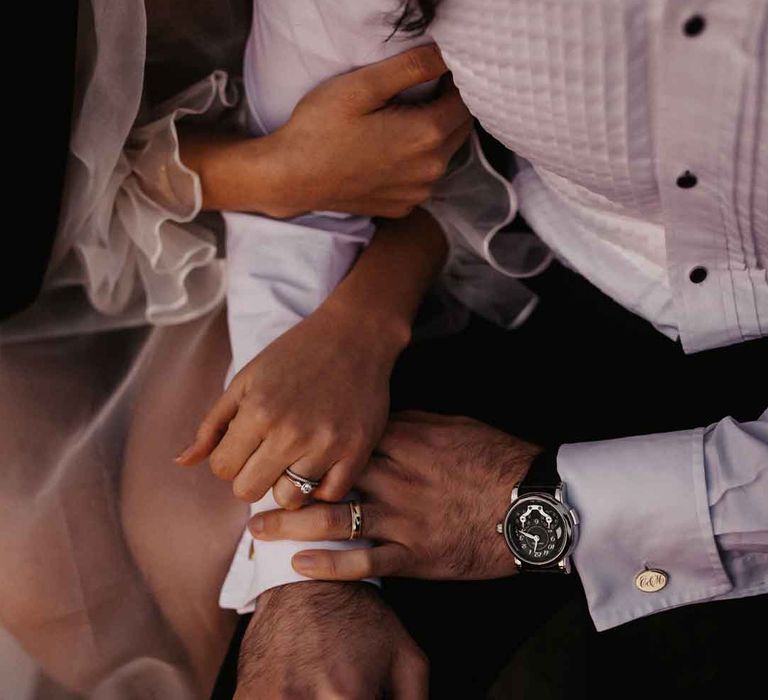 Bride and groom linking arms at Elmley Nature Reserve wedding 