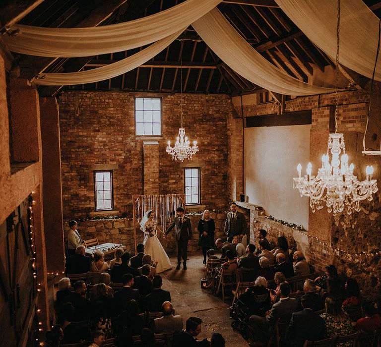 Exmouth Country Lodge wedding venue in Devon with white drapery and fairy lights for rustic romance wedding theme 