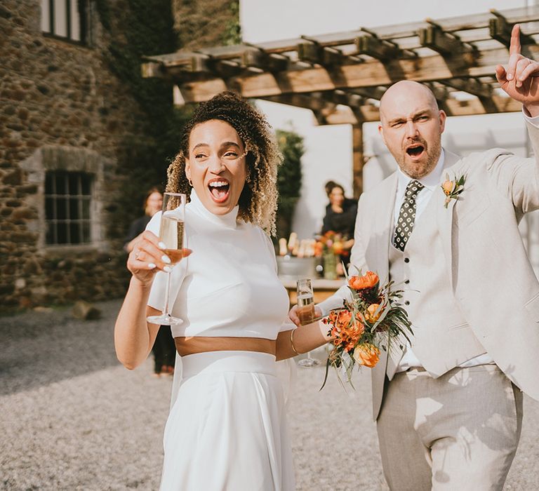 Bride and groom have some celebratory drinks after their ceremony 