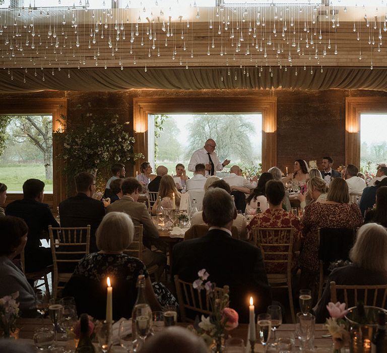 Father of the bride performs his wedding speech at the country house wedding venue 