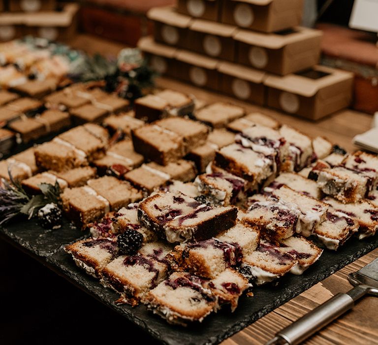 Dessert table with slices of cake and brownies 