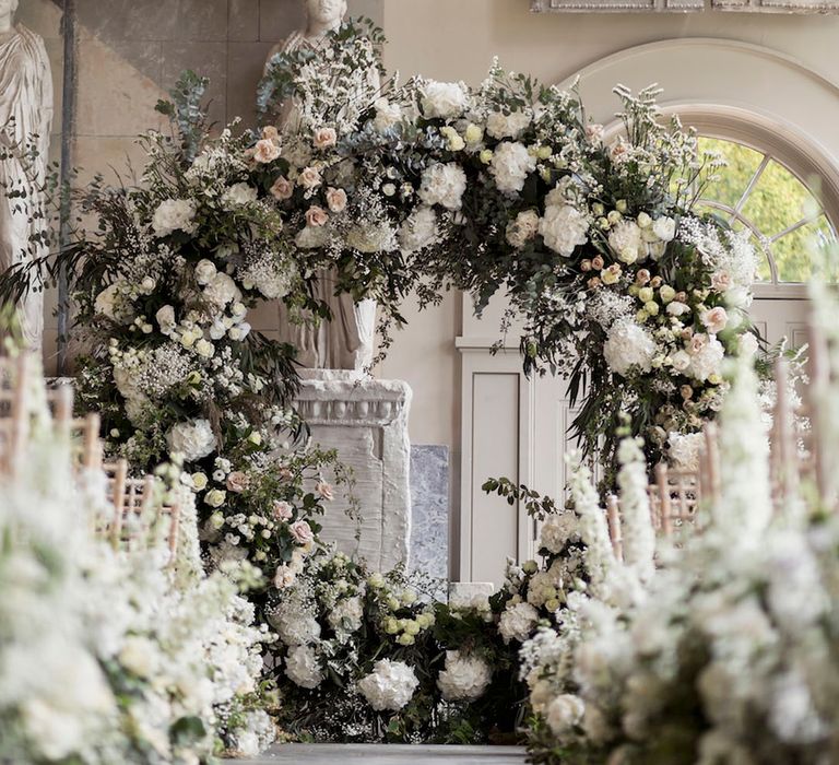 White floral moongate altar decoration for winter wedding with white winter wedding flowers 