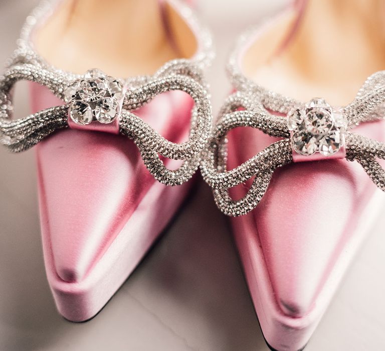 Bright pink pointed wedding shoes with sparkly bow detail 