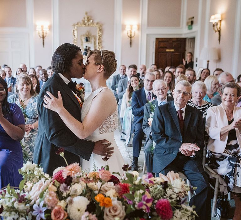 The brides share their first kiss as a married couple 