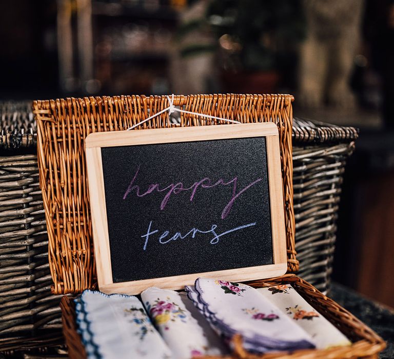 Floral handkerchiefs in wicker basket for guests who cry at the wedding 