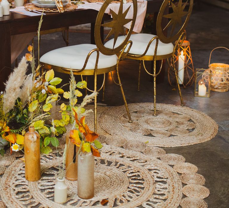 Earthy wedding ideas for a wedding table set up with gold chairs