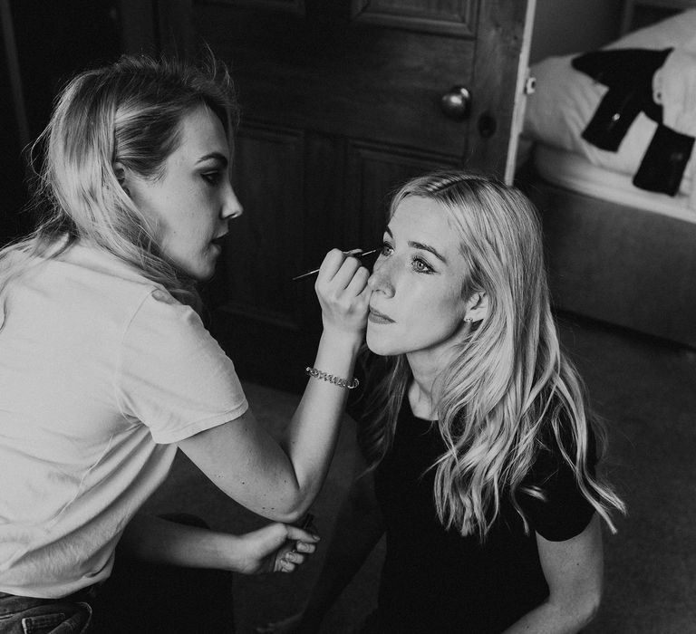 Bride has her makeup done on the morning of her wedding