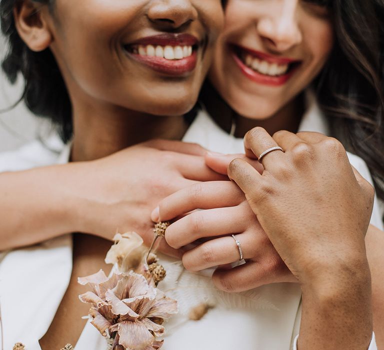 Minimal, stylish and silver hers and hers wedding bands for all white wedding