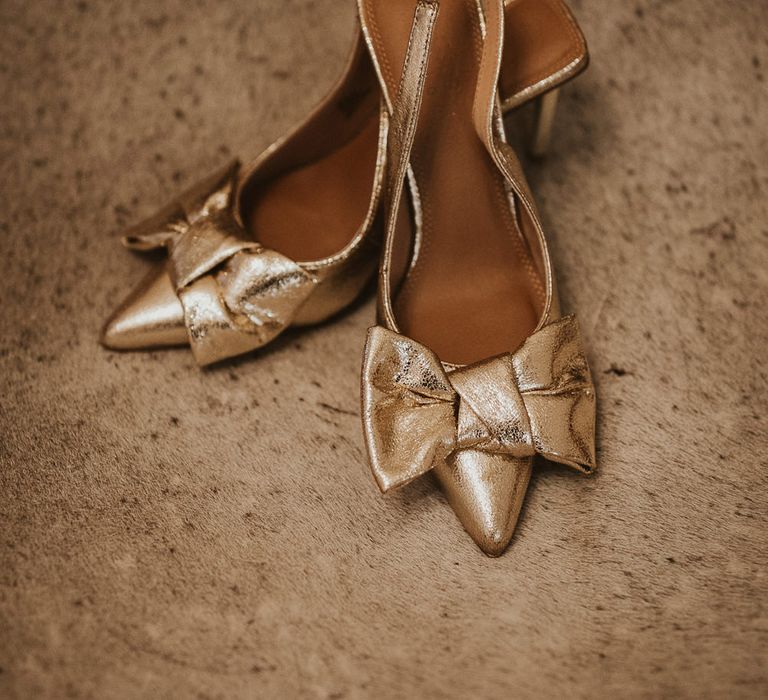 Shimmering gold sling back wedding shoes with bow front detail 