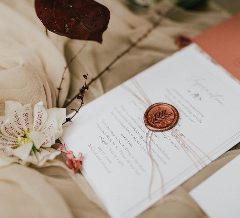 Wedding stationery information card with bronze wax seal 