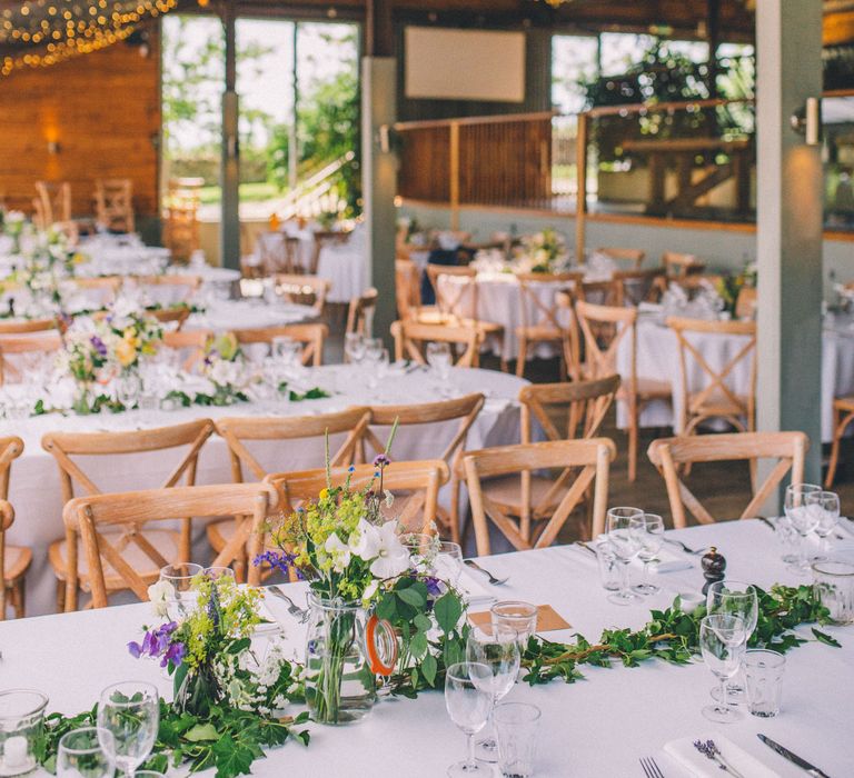 Rustic wedding reception venue complete with hanging fairy lights | Story + Colour