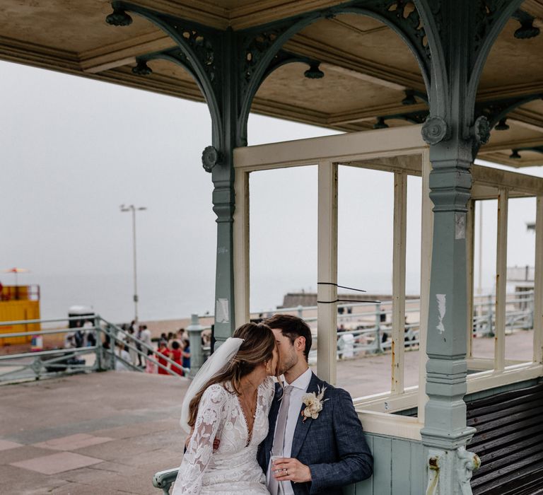 Bride and Groom share a kiss at Brighton bandstand wedding