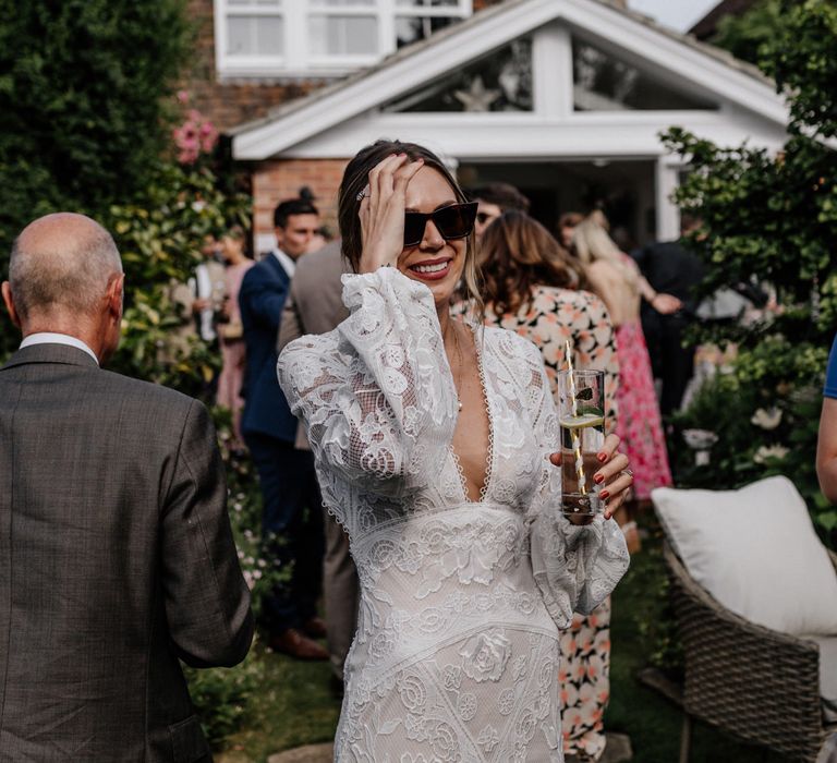 Bride in lace detail long sleeve wedding dress