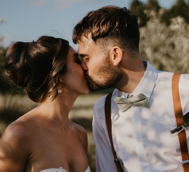 Bride & groom kiss outdoors on their wedding day | Mark Bamforth Photography