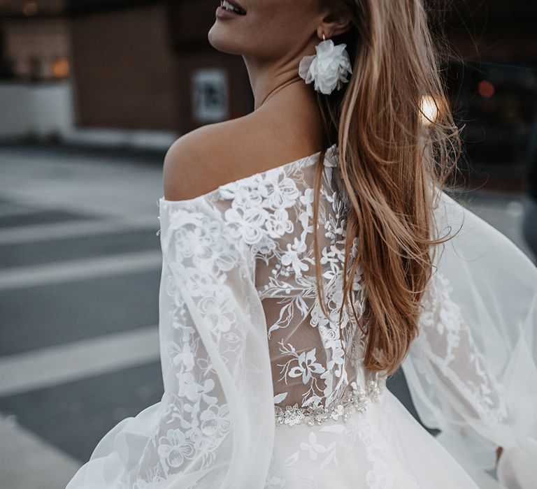 Lace appliqué wedding dress with sheer long blouson sleeves by Daniel Chu 