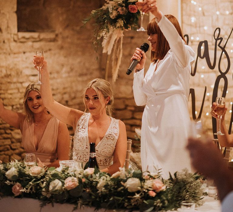 Brides make a toast with their wedding guests