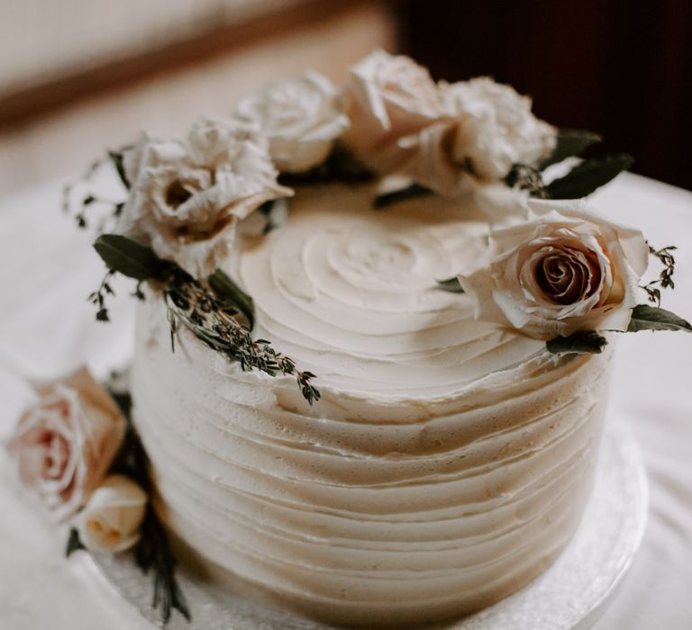 Classic white wedding cake completed with floral decor