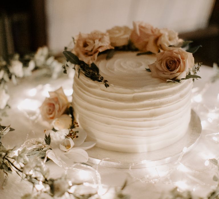 Wedding cake with classic white frosting and floral decor