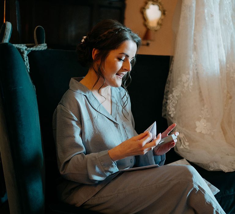 Bride wears grey pyjamas on the morning of her wedding day as she opens gift 