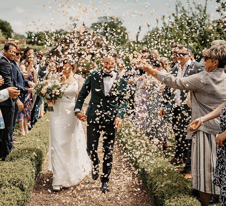 Bride and groom have a confetti exit moment 