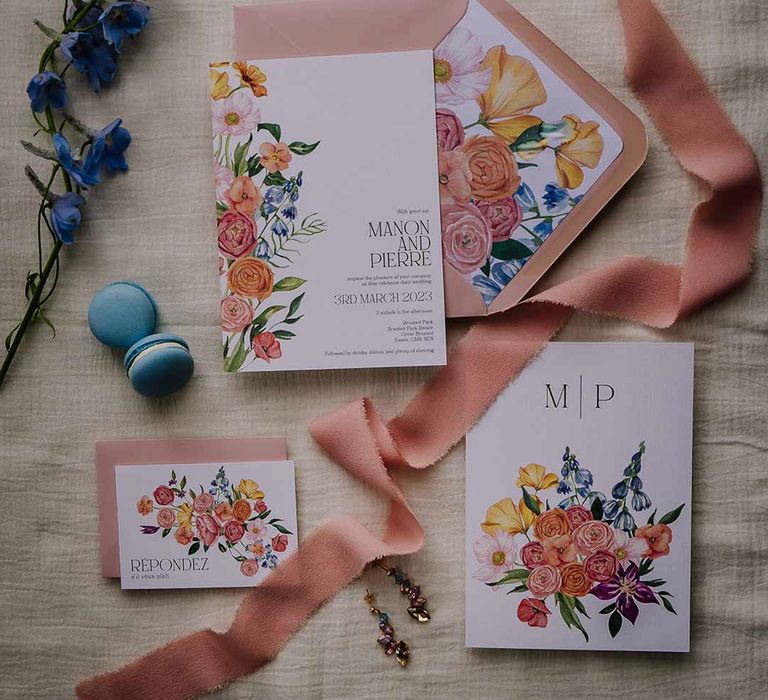 Botanical luxe wedding stationery in white and dusky pink with water colour flower designs, blue macaroons, dried foliage and gold wedding jewellery 