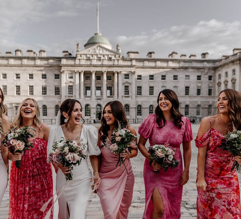 Mismatched pink bridesmaid dresses worn by the bridal party at city wedding in London 