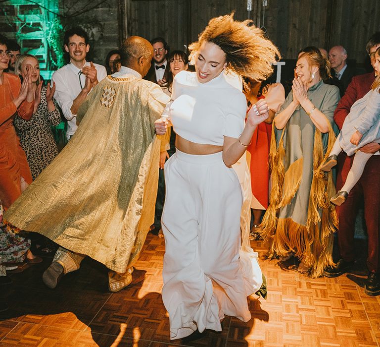 Father of the bride and bride participate in father daughter dance 