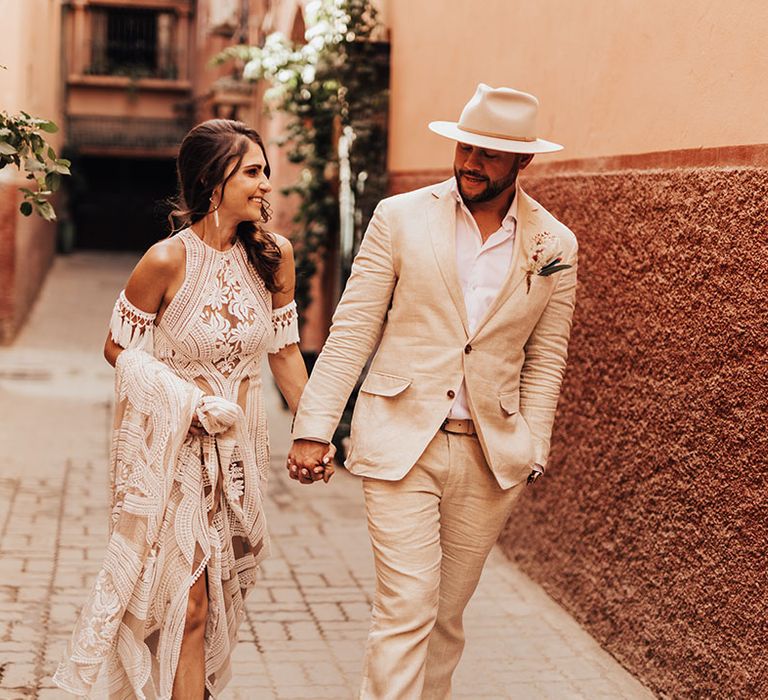 A Marrakech intimate destination wedding with the bride and groom wearing boho chic wedding outfits 