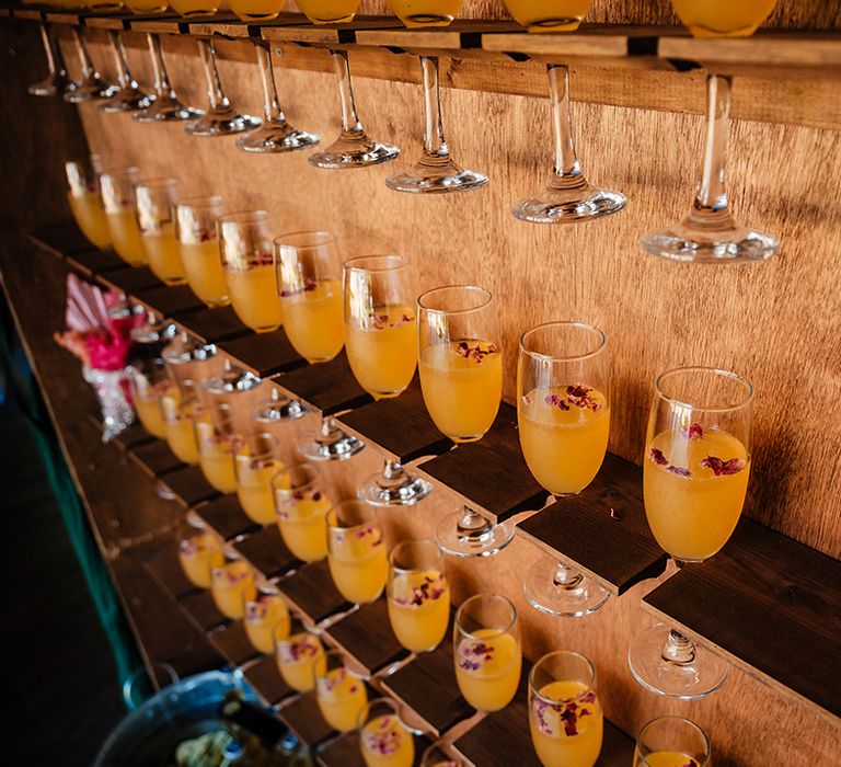 Peach Bellini signature wedding cocktail drinks with edible flowers 