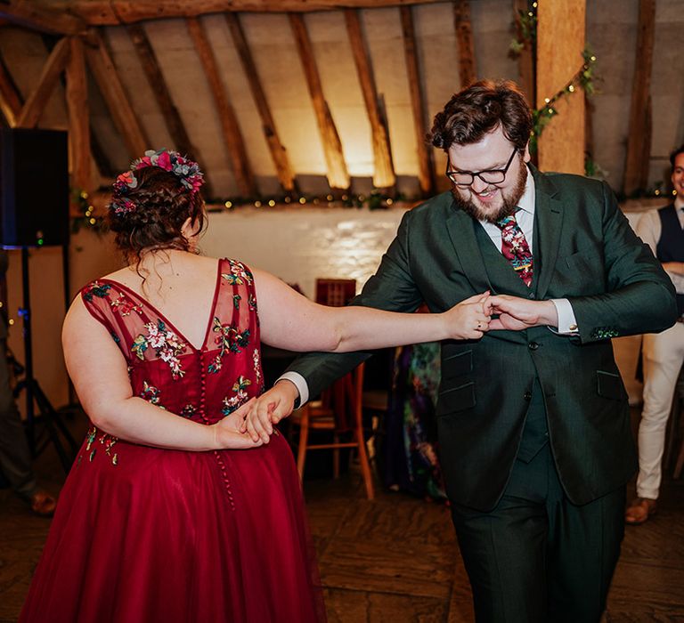 The bride and groom have their first dance together at Ufton Court barn wedding 