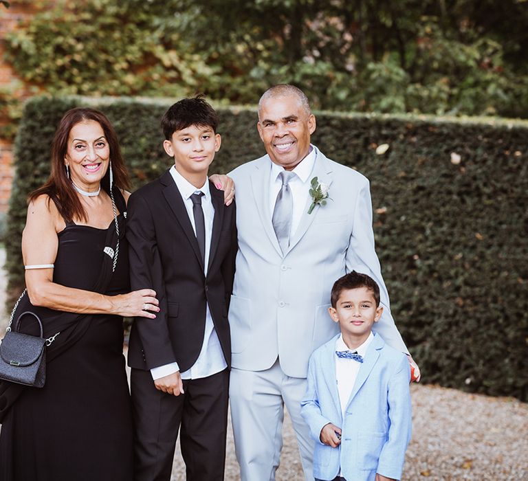 Wedding guests wearing black and blue wedding outfits for same sex wedding 