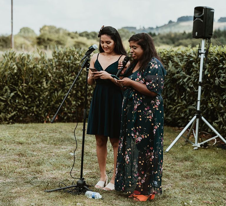 Wedding guests perform a wedding reading for the ceremony 