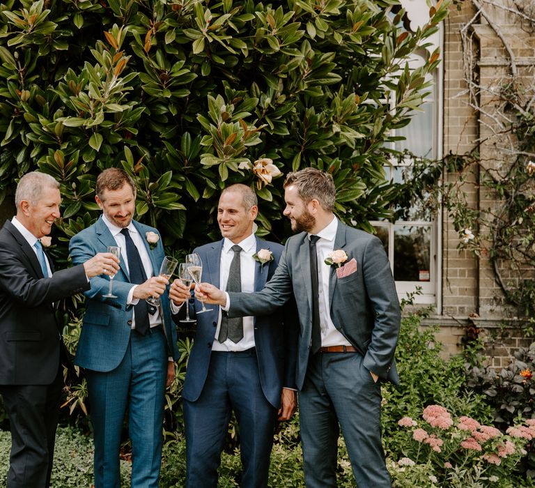 Groom with wedding guests at Pylewell Park