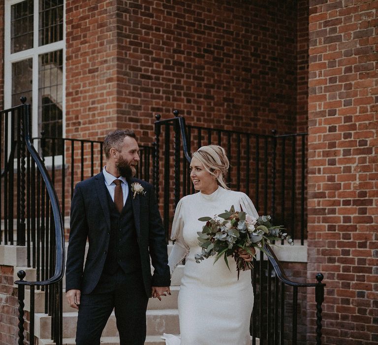 Bride and groom exiting the wedding ceremony as husband and wife 