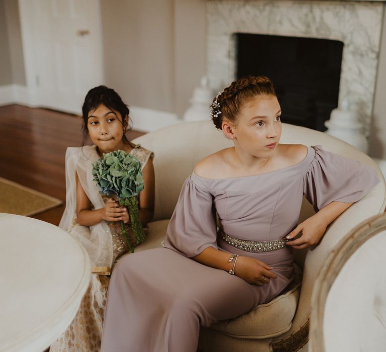 Junior bridesmaids in pastel dresses for multicultural wedding 