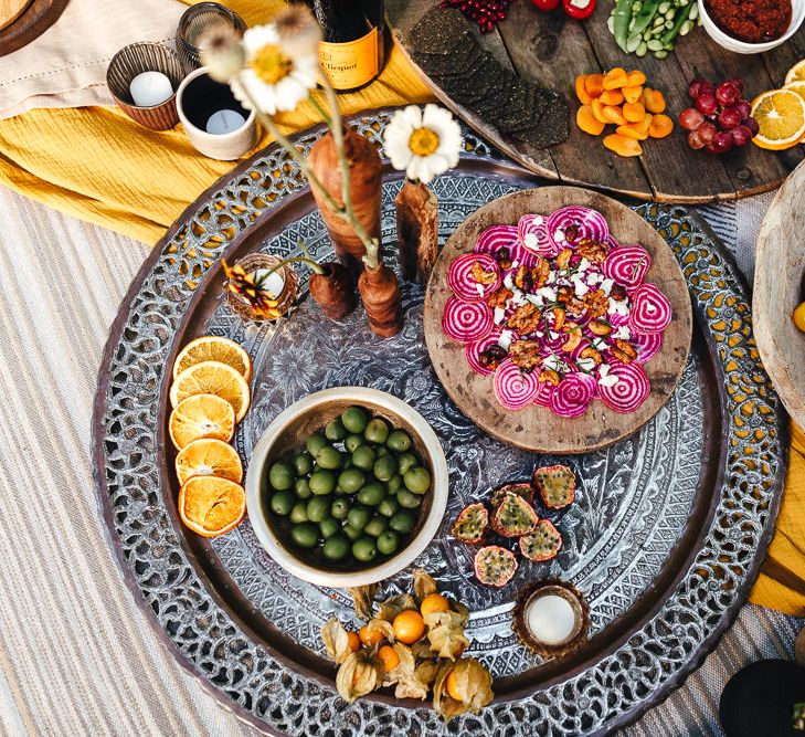 Outdoor grazing table with colourful foods 