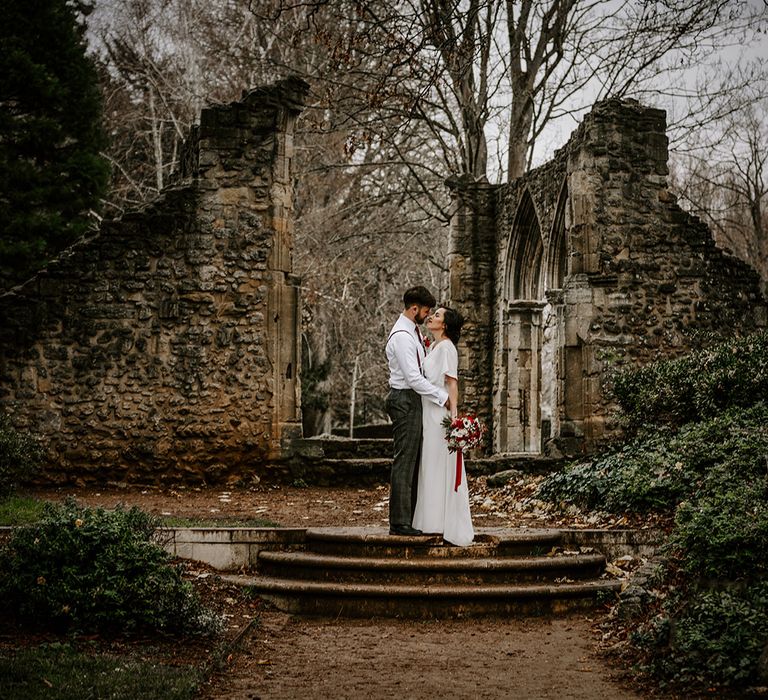 Bride and Groom in churchyard ruins